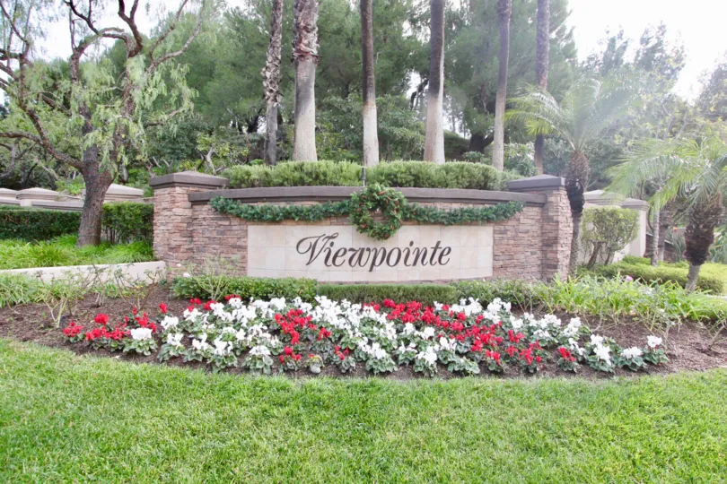 The Viewpointe with nice green grass around and lots of flowers and trees