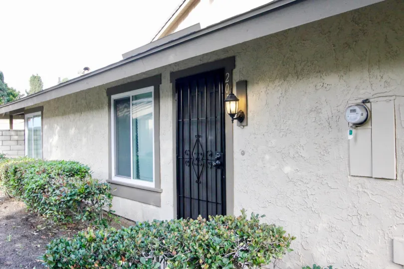 The entrance to a unit in Anahiem Gardens showing the landscaping and front door