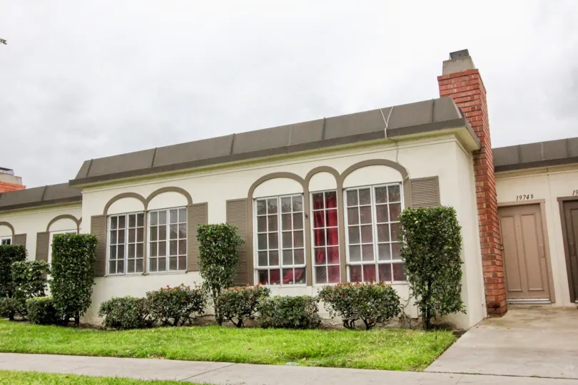 White home with brown trim and windows at Anaheim Village III in Anaheim CA