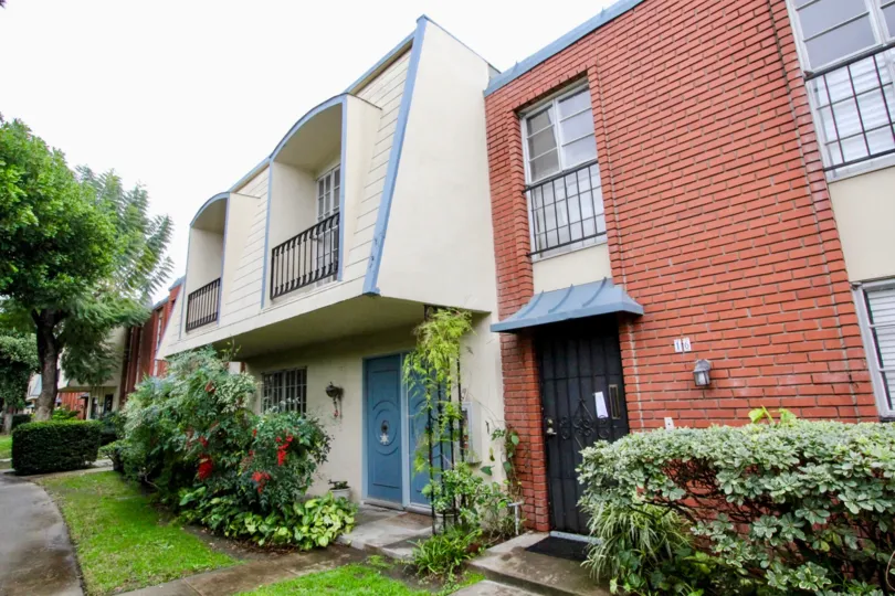 A multi-clad unit in Anaheim Village III colored in white and blue.