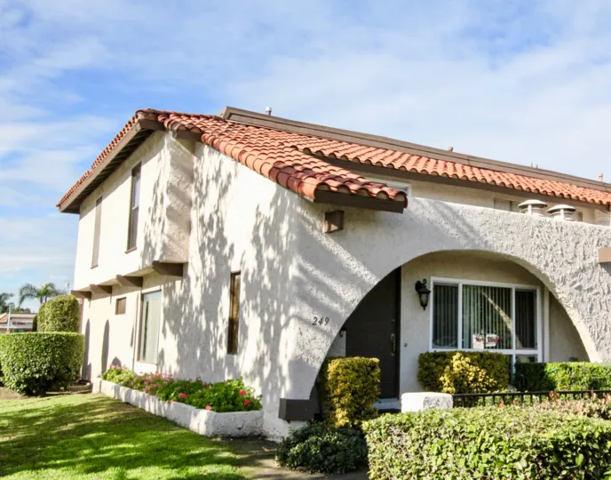 White, two-story home on a sunny day in the Aron Place neighborhood of Anaheim