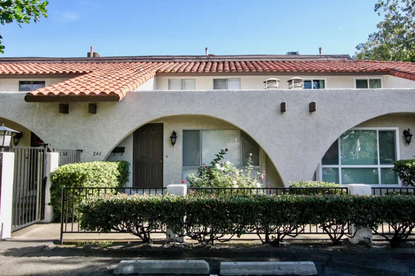 An elegant house in Aron Place community with tiled roof and hedges