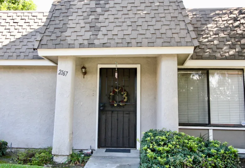A bungalow with covered front entrance in the Broadmoor Arms community.