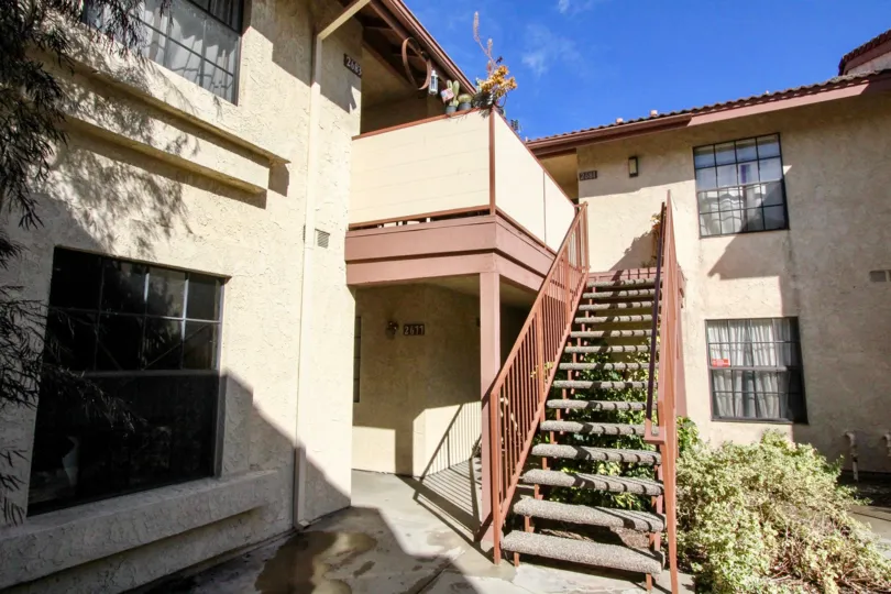 A beautiful day in Anaheim California with landscaping and and apartment complex.