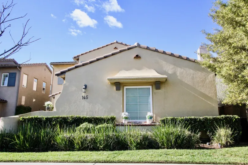 Sloped brown house with brick roof in Cantada Square, Anaheim CA