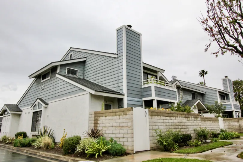 Several large two story blue homes in Carbon Creek community in Anaheim, California.