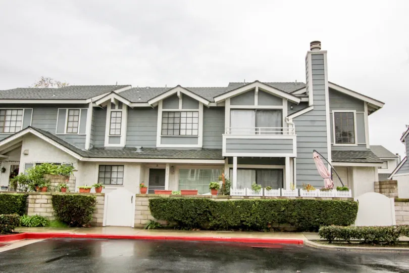 Nice front view of a villa on a rainy day with small plants in Carbon Creek of Anaheim