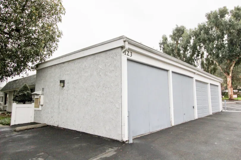 Simple white-gray garage and tree in Casa Canon, Anaheim CA