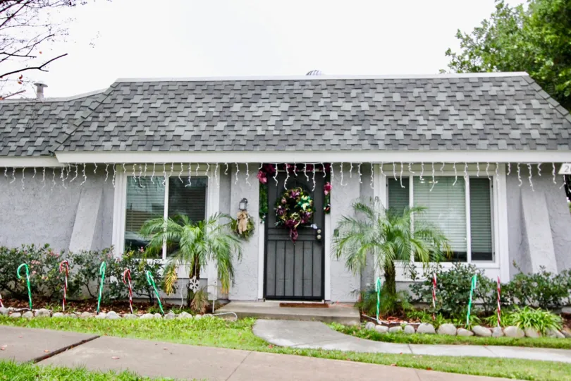 Cute little home manicured lawn inc sunny Casa Canon in Anaheim California.
