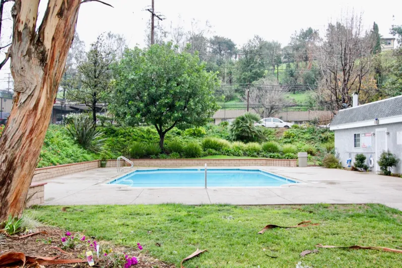 a pleasant day in the casa canon with a park that has swiming pool and garden around