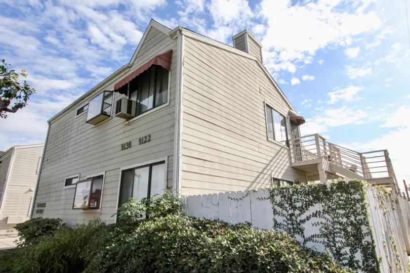 Tall brown house with outside stairs in Cerritos Manor, Anaheim CA