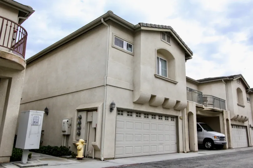 A corner view of two townhouse unit in Citrus Villas community with decorative eaves.