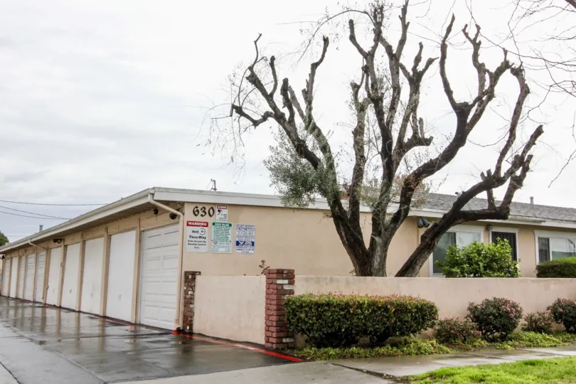 THIS IMAGE SHOWS THE LOT OF SHEDS, NUMBER ON THE WALL, RIGHTSIDE PATHWAY, SMALL PLANTS ARE THERE IN ANAHEIM CITY