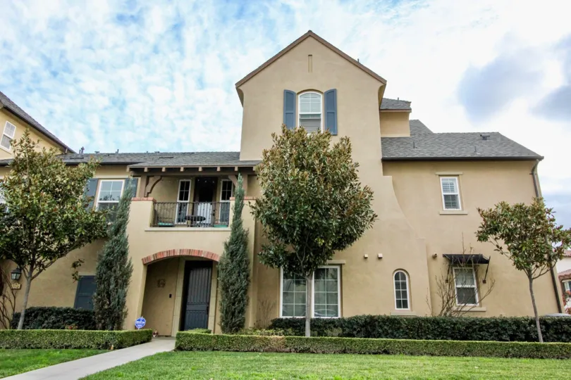 A two storied building with large windows and beautiful meadow in Colony Park community