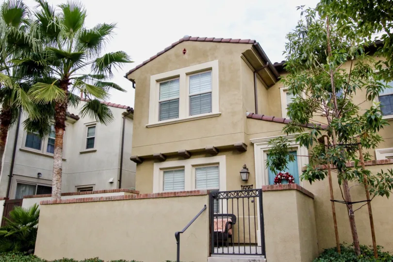 Tan home on an overcast day in Colony Park community of Anaheim, California
