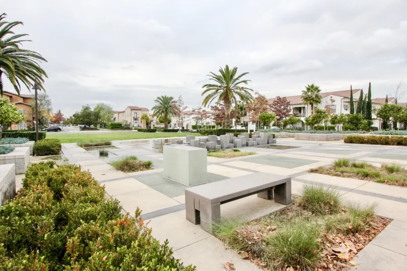 A public park in the Colony Park community with stone seating and sculptures