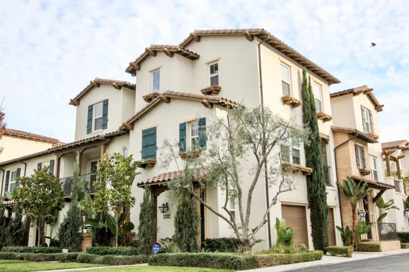 THE FLAT WITH TREES, SMALL PLANTS, LAWN, GLASS WINDOWS, EMPTY SPACE ON THE SIDE ARE SHOWN IN ANAHEIM CITY