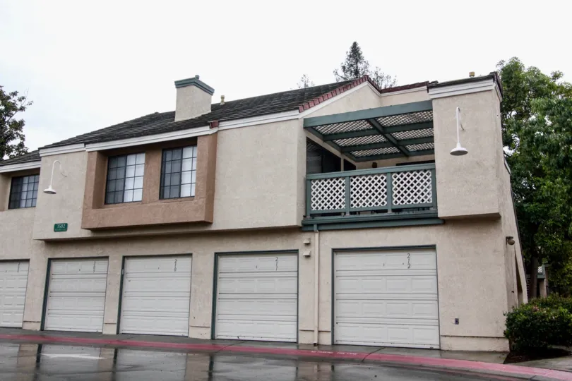 An attractive house with large garage doors in the Evergreen village community