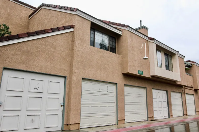Simple brown building with white garages in Evergreen Village, Anaheim CA