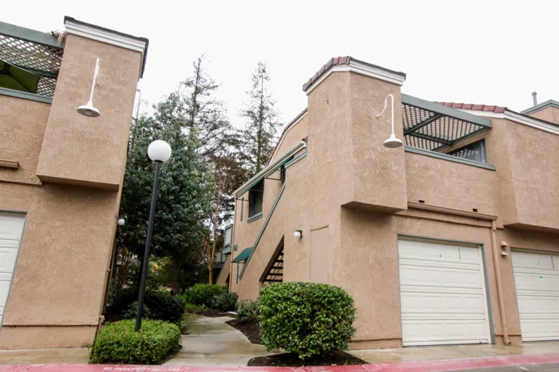 Two buildings, showing garages and pathways, in the Evergreen Village community