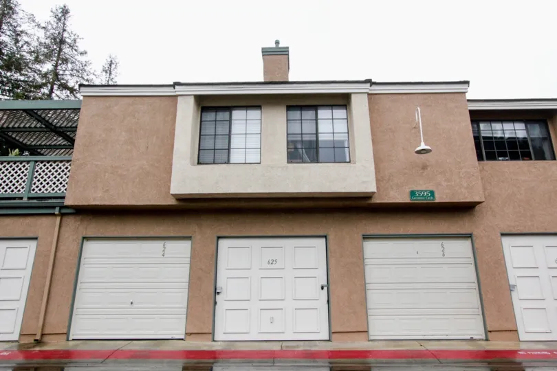 A two storied house with a wide front door inside Evergreen Village community