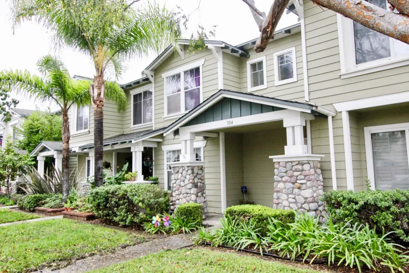 A beautiful house with palm trees and well maintained lawn in the Heritage place bungalows community