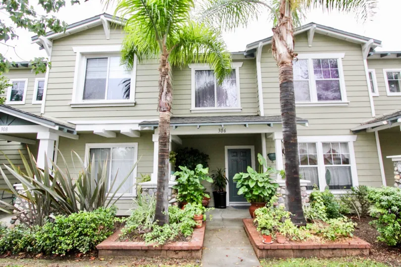A beautiful house in Heritage Place Bungalows community with lot of plants in front