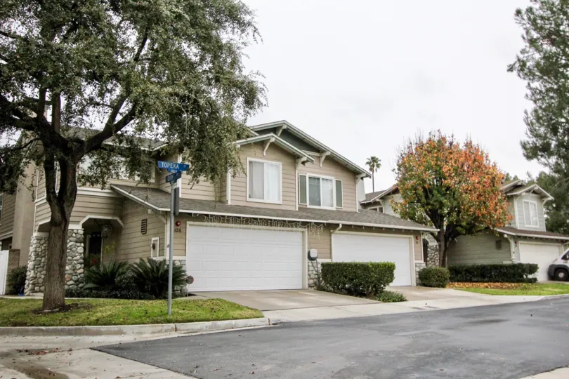 Mature trees surround a townhome community in Anaheim's Heritage Place Cottages