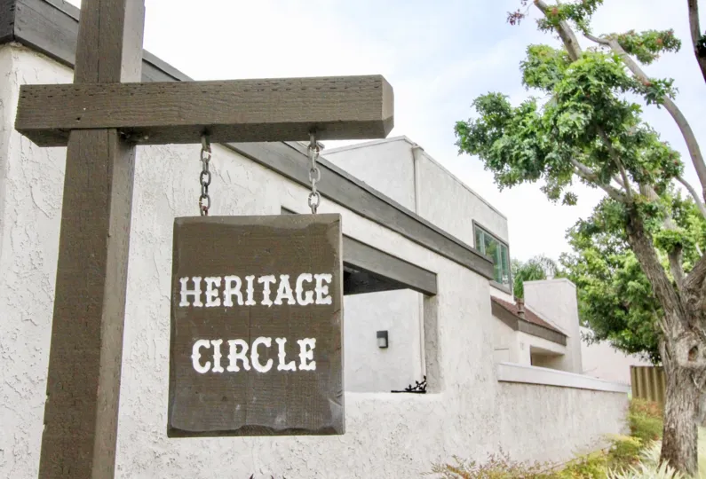 The magnificent village homes in heritage village townhomes with nameboard and trees