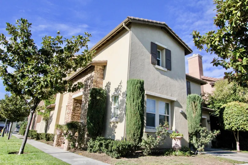Under the blue clear sky lies the simple and elegant house in Magnolia Lane community