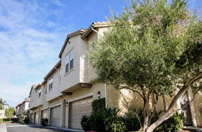 side view of row houses inside Magnolia Lane community with a wide drive way
