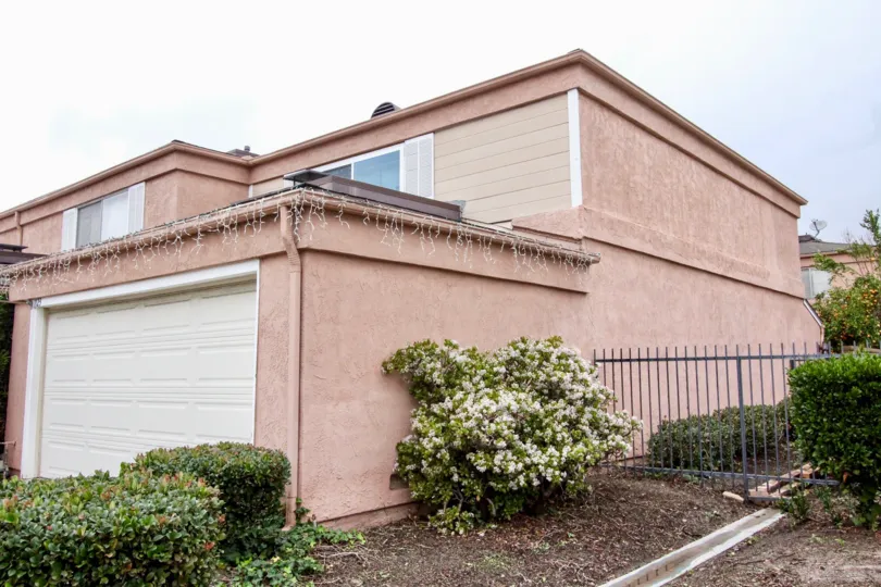 View from the side of a pink stucco home in Northwoods Village, Anaheim, CA