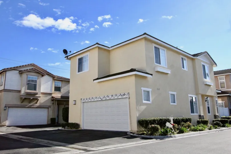 A NICE HOUSE WITH COLOUR OF LIGHT YELLOW WITH BROWN BORDERS IS VERY CUTE