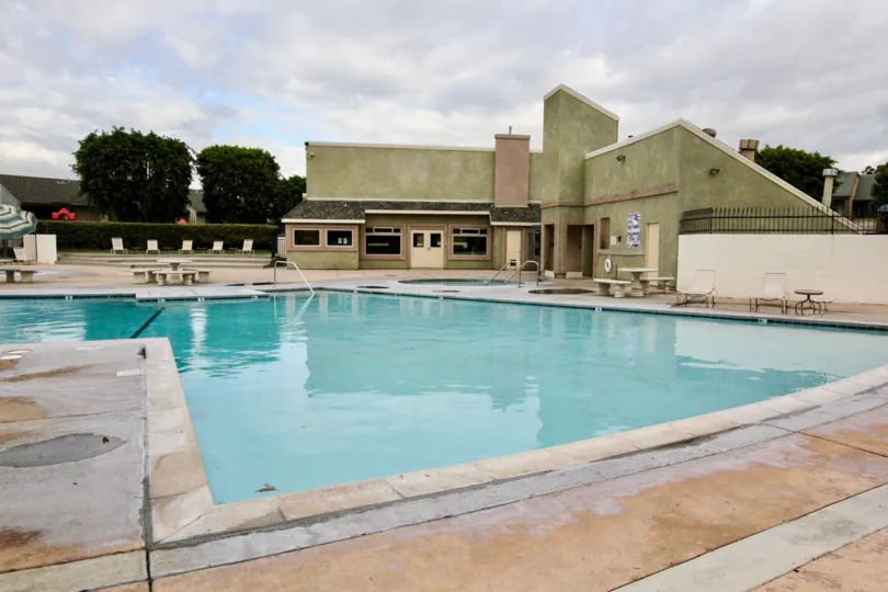 A PLEASANT DAY IN THE Pepperwood Village WITH A BUILDING THAT HAS swimmingpool AND RESTING TABLES