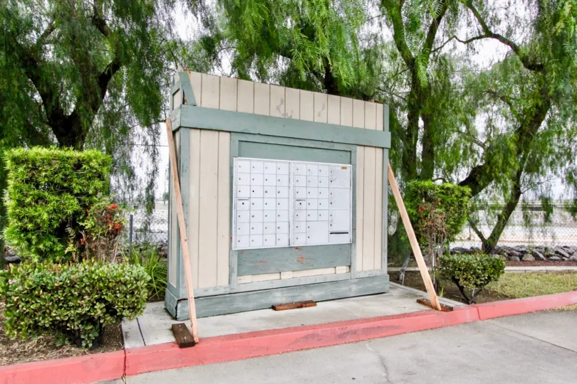 Surrounded by trees, the mailbox location for the Pinetree Village community in Anaheim, California.