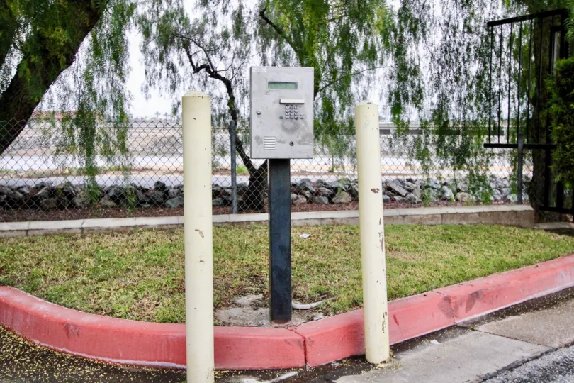 Security Phone box is placed on the meadows in platform with trees on Pinetree Village