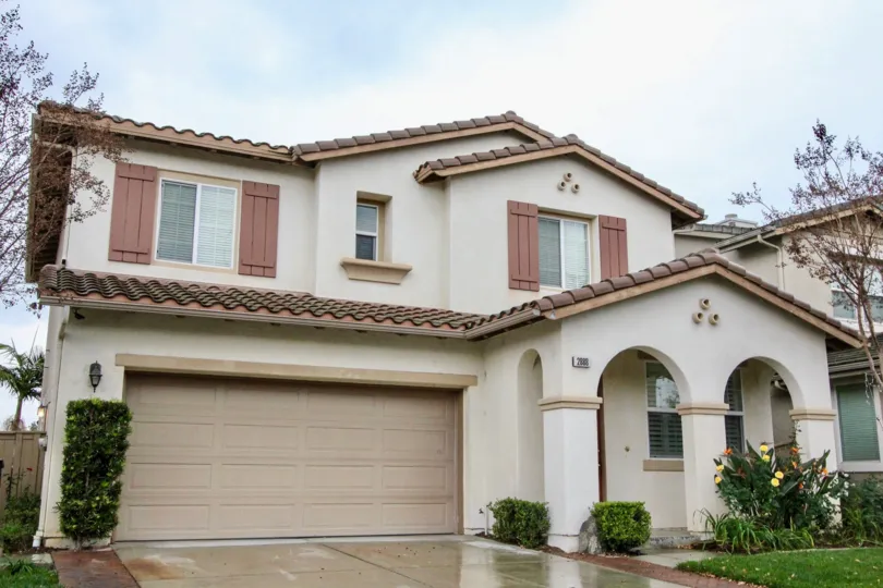 Residing in the commnity of Rio Vista Walk, Anaheim California, a two-story home with beautiful front entrance.