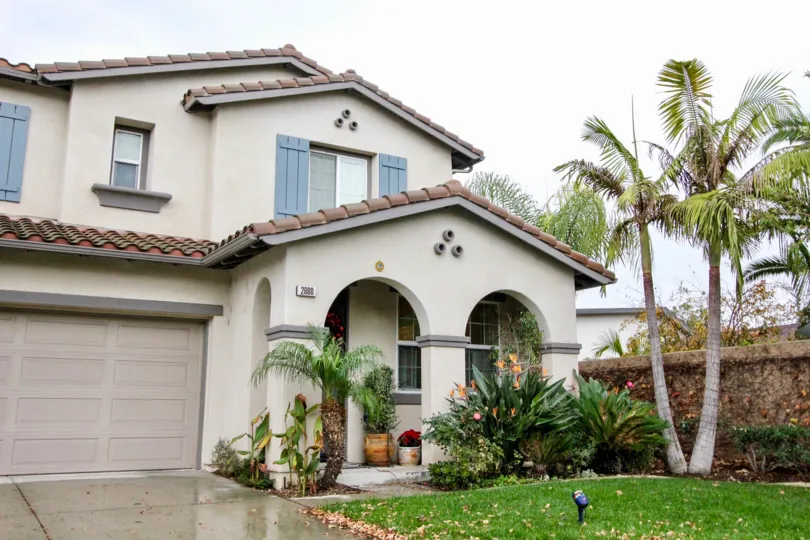 A wet day in the Rio Vista Walk with house and landscaping