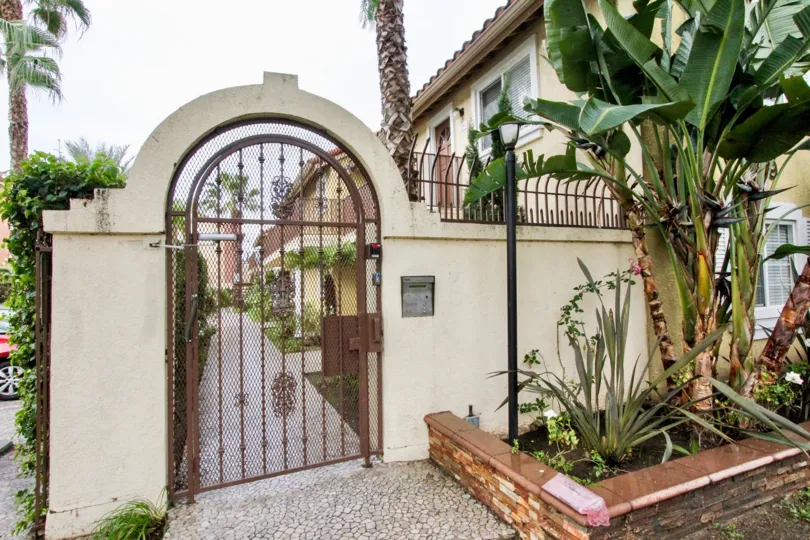 THE ENTRANCE OF THE HOUSE WITH LOT OF PLANTS, TREES SHOWN IN ANAHEIM CITY