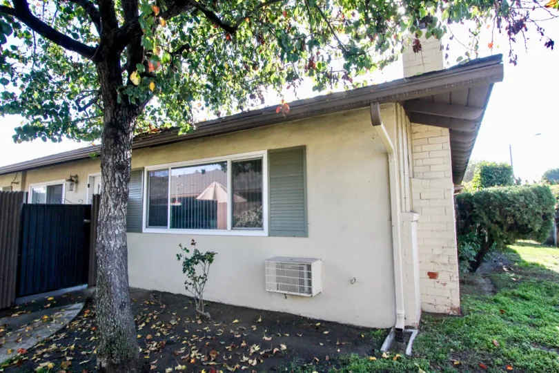 Quiet real estate with trees, shrubs, fencing and privacy.