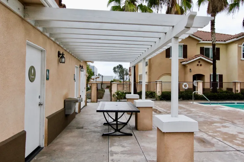 The common area around the pool at the Villa de Euclid community