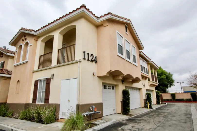a pleasant day in the villa de euclid with a house that has numbered as 1124 and 3 parking door closed