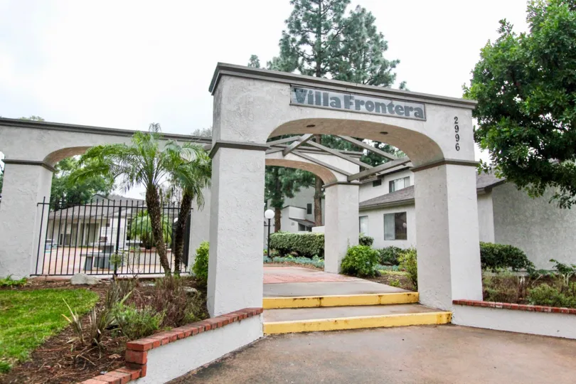 a pleasant day in the villa frontera with a park that has steps in center and garden around