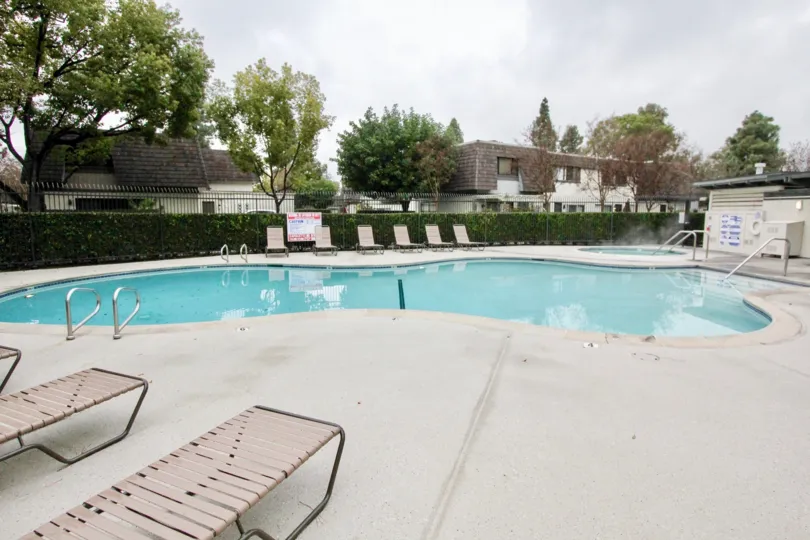 A day with clear skies on the side of the pool in Village Green.