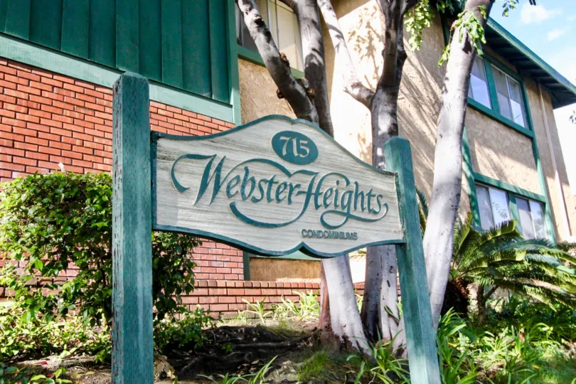 THE FLAT IN THE WEBSTER HEIGHTS WITH THE 715 WEBSTER HEIGHTS CONDOMINIUMS BOARD, PLANTS, TREES