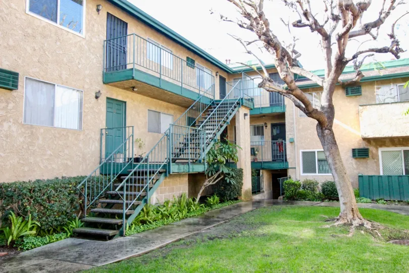 The exterior stairs, entries and courtyard at the Webster Heights community on a sunny day