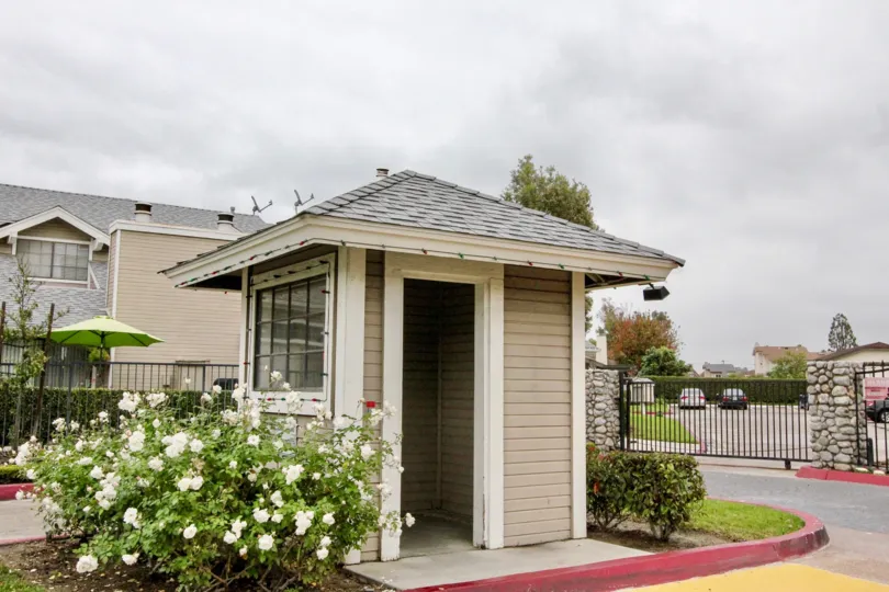 THE BUNGALOW IN THE WELLINGTON LANDING WITH THE FLOWER PLANTS, CAR PARKING, UMBRELLA