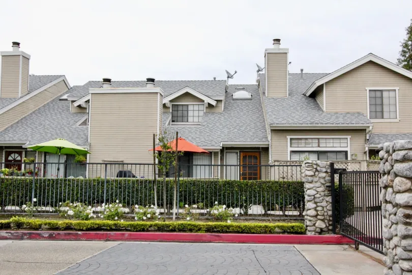 THIS IMAGE SHOWS THE HOUSE ON THE FRONT PLANTS, UMBRELLA, EMPTY SPACE, DISHES ARE THERE IN ANAHEIM CITY
