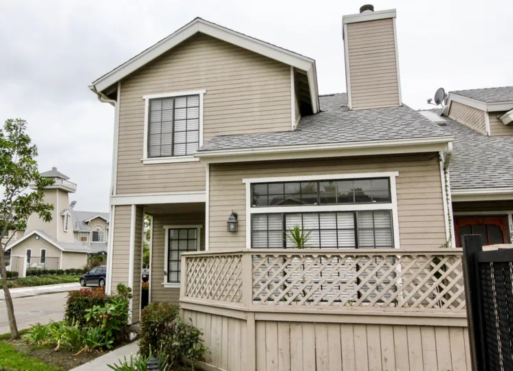 a pleasant day in the wellington landing with a house that has roofless top and garden in front