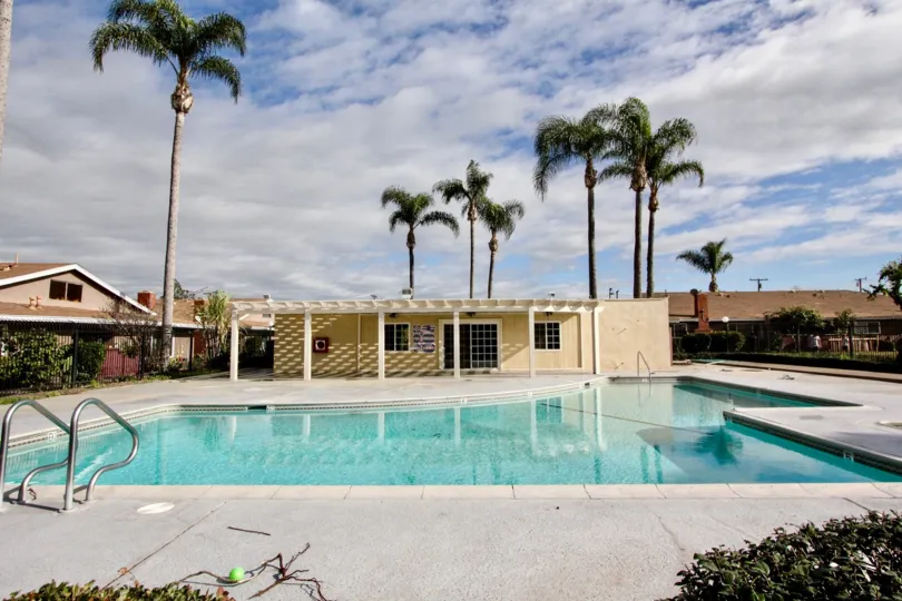 THE CLOUDY SKY IN THE WESTWOOD VILLAGE WITH THE SWIMMING POOL, PLANTS, TREES